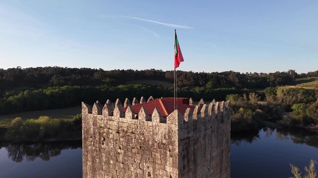 Lapela tower a medieval castle reflecting in the calm waters of minho river