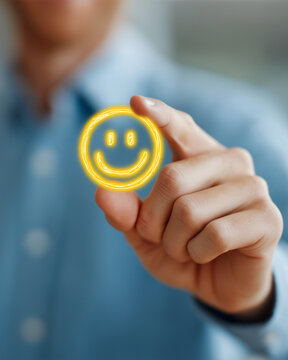 Embrace the Smile: A close-up shot captures a person holding a radiant smiley face icon, symbolizing happiness and positivity.