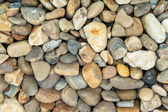 background made of a closeup of a wall with pebbles