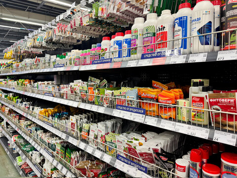 Barnaul, Russia, 06.06.2025: Russian garden store shelves stocked with pesticides, herbicides, and pest control products including Tornado, Fitoverm, and Atar brands.