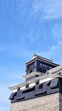 Kumamoto castle fort keep behind stone walls, Feudal Japan, Historical Landmark, Japanese Samurai Fortress, Travel Landmark, Panning Shot