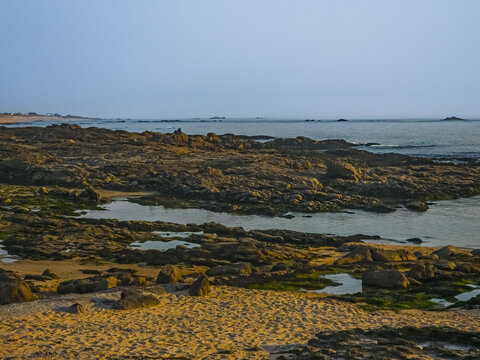 Rocky coastal shoreline at Praia do Paraiso Portugal