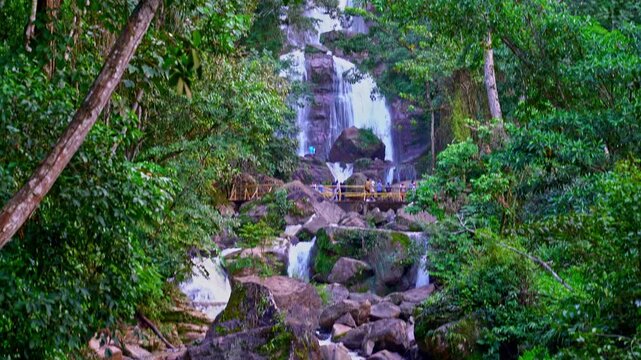 Tropical waterfall landscape in Peru surrounded by rainforest, rocks and river stream, natural jungle ecosystem and travel destination.