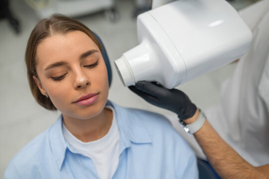 Stomatologist taking dental radiograph closeup
