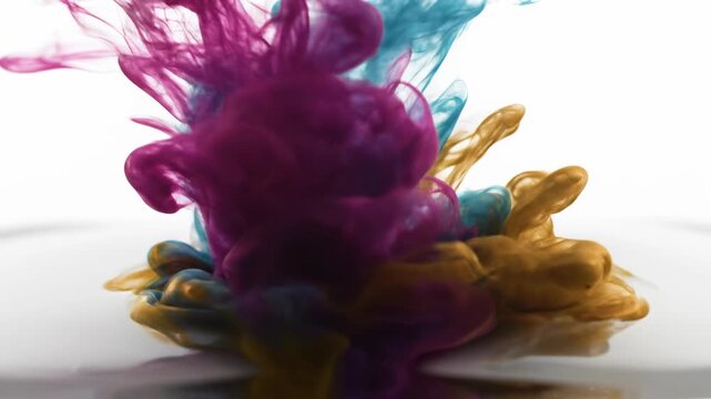 Vibrant fluid pigments swirling in dynamic aqueous suspension, creating beautiful abstract organic formations of striking magenta, turquoise, and golden hues that evoke chemical reactions