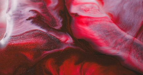 Obraz premium Paint wave. Colorful spill ink. Defocused red pink purple vibrant liquid sparkling particles floating on abstract bright background.
