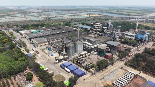 Aerial View Of Distillery Factory Next To Highway