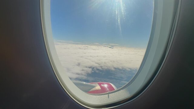 Tranquil Ascent Over Vast Cloud Landscapes. Gentle Voyage Through Luminous Sky With Sprawling Cloud Fields. Serene Ascent Soaring Above Expansive Cloud Formations Illuminated By Sunlight