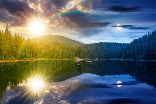 day meet night. landscape by the lake. coniferous forest near the lake and the forest mountain. epic summer solstice view of carpathian mountain reflection on synevr lake surface. harmony concept