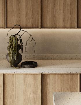Minimal kitchen detail with wooden cabinetry, countertop decor and soft backlighting highlighting textures and materials. Close-up view