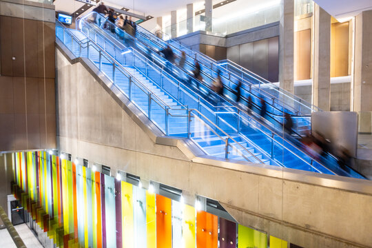 People on moving escalators at Sainte-Anne metro subway station in Rennes - France