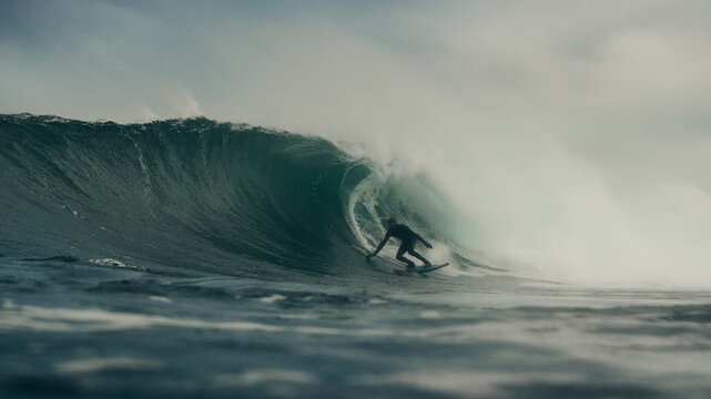 surfer and storm over the sea