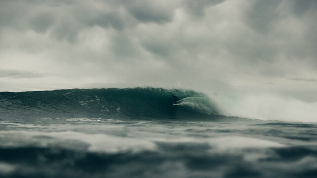 surfer and storm over the sea