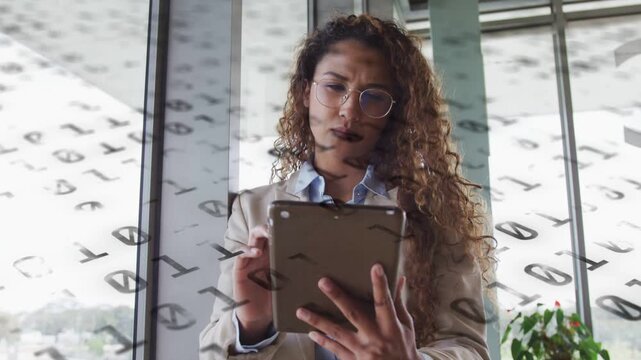 Business analyst tapping tablet and swiping, analyzing dashboard while analytics overlay drifting
