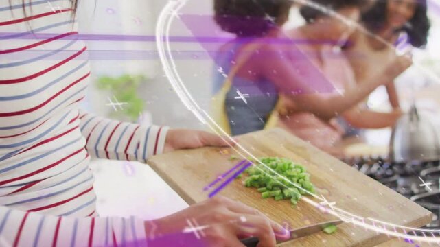 Cook starting food prep chopping herbs on board purple overlays guiding bowl transfer team at stove