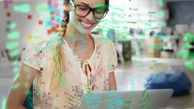 Woman typing on laptop and reading message smiling as green code overlay floating across tech frame