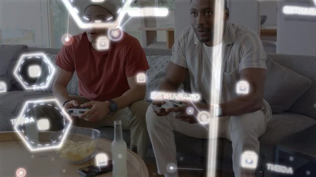 Two men pressing pads starting gaming AR HUD overlaying hexes while right player celebrating win