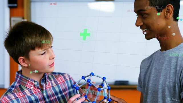 Student in plaid shirt touching model triggers peer in grey tee guiding, HUD highlighting chemistry