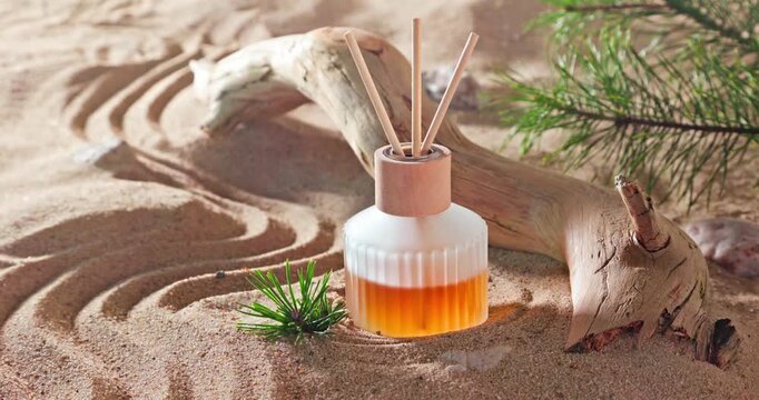 Intense fragrance diffuser on sandy beach in summer.