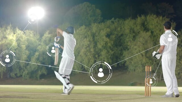 Batter shifting and playing shot as bowler bowling ball, cricket data overlay linking team to score