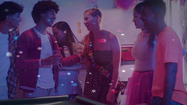 Teens gathering around pool table for event, handshake sparking birthday toasting with confetti