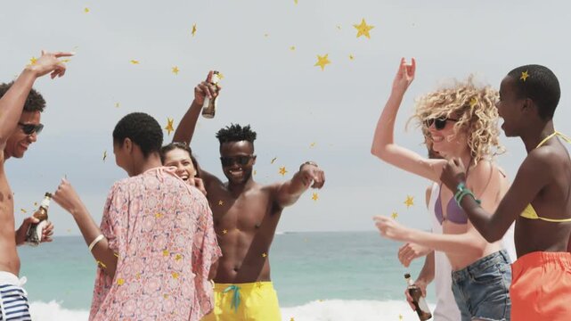 Group raising bottles, confetti falling around, celebrating and walking to cam on beach for travel