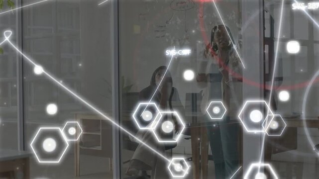 Standing woman raising marker drawing board to brainstorm biz data hex mapping red ring marking her