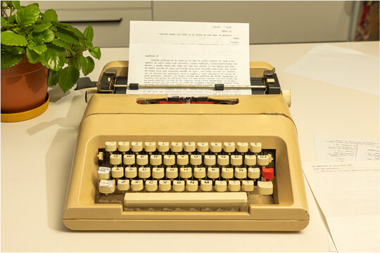 Vintage Typewriter Olivetti Lettera 35 on Writer&rsquo;s Desk with Paper and Creative Workspace Atmosphere