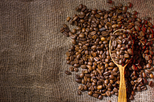 Coffee beans poured into a coffee maker.
