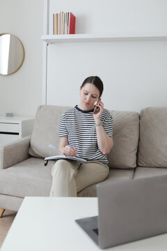 Creative photo of a busy business woman working with documents at workplace in a modern office. office manager or freelancer in a stylish room.