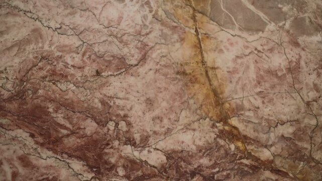 Close-up shot of a marble surface featuring a natural rock in the center