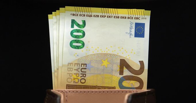 Euro banknotes in wallet. European Money. Cash, finance, savings, wealth. New two hundred Euro banknotes. One thousand Euros in five 200 euro banknotes