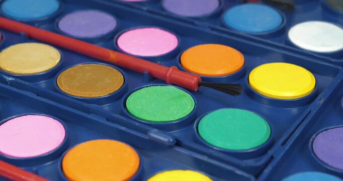 Watercolor paints for painting. Artist watercolor sets with brushes for creative work. Watercolor palette for painting projects