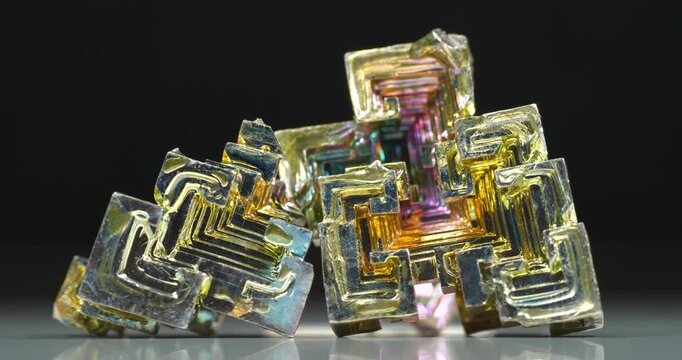 Bismuth crystals. Bismuth - chemical element with symbol Bi and atomic number 83. Post-transition metal and one of pnictogens. Synthesized bismuth crystal. Iridescent coloration is due to oxide film