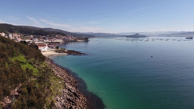 Rax&oacute;, Poio Pontevedra Galicia. Coastal town bay with fishing boats and beach