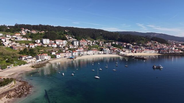 Rax&oacute;, Poio Pontevedra Galicia. Coastal town bay with fishing boats and beach