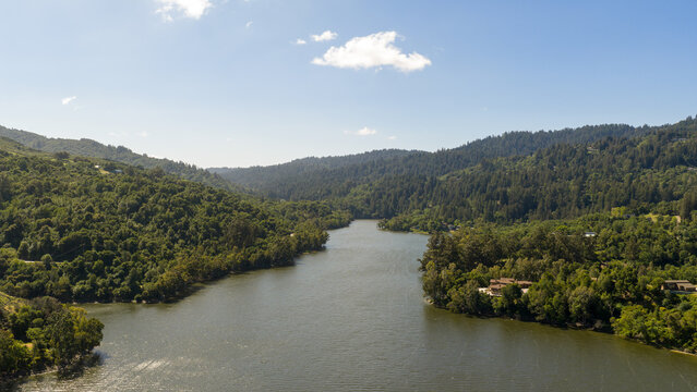 Aerial View of Snow-Capped Mountain Peaks and Blue Water at Gilroy reservoir California