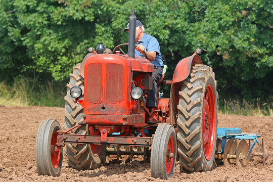 	
Vintage tractor ploughing a field	