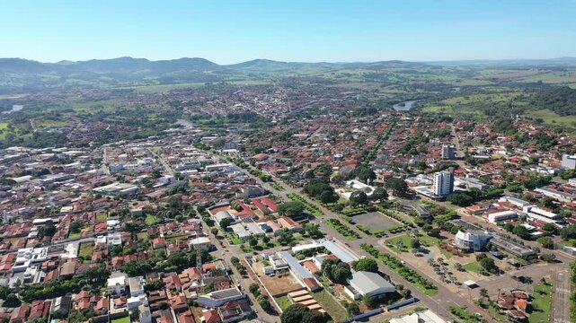 Aerial view of town of Ceres surrounded by mountains and green valleys on May, 2026. Ceres, Goias, Brazil