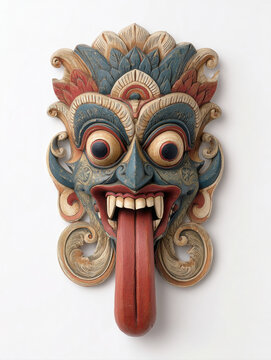 Hand carved and painted ritual mask featuring intricate details, fangs, and vibrant colors. Ethnic asian decorative art representing spirit mythology and historical folk craftsmanship of Indonesia.