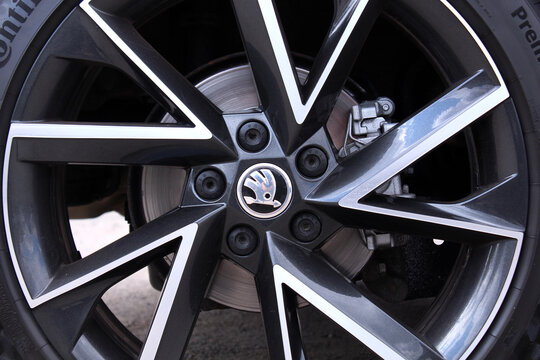 Vinnytsia, Ukraine; May 2, 2026. Skoda Karoq wheel. Skoda Karoq front wheel with brake disc and caliper. Cast alloy wheel of Skoda Karoq with Logo. Skoda logo on a black alloy wheel.