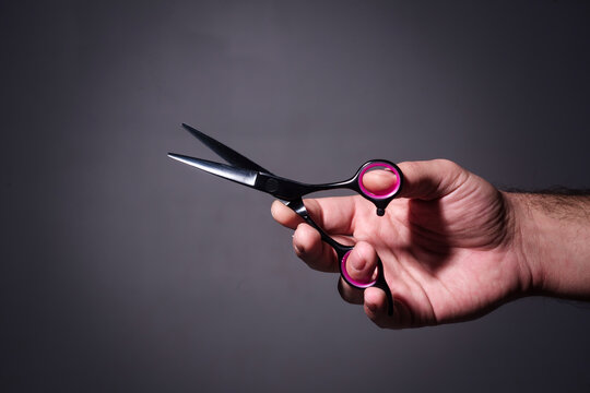 Barber tools and scissors. Man haircut in barbershop. Professional barber scissors and grooming. Classic barbershop look.