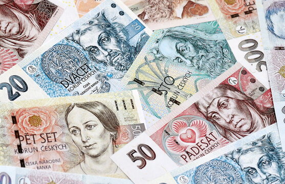 Czech koruna money bills pile on table. Czech Republic banknotes of CZK currency close up.