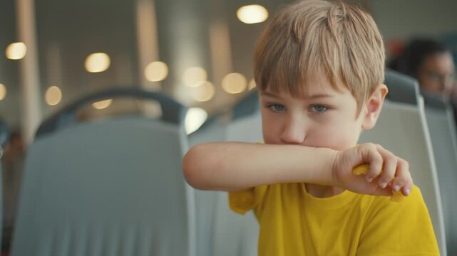 Child talks with curiosity in a bright indoor space with people around