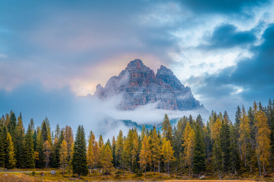 Tre Cime di Lavaredo, view for Antorno lake. Scenic autumn morning scenery with colorful sky . Travel destination copy space banner