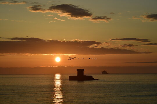 St.Ouen's, Jersey, U.K. Spring sunset with 19th century Rocco tower.