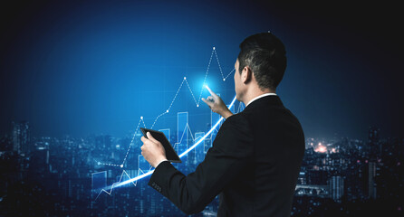 Businessman stands against a city skyline at night, analyzing growth trends using a tablet and digital chart, symbolizing modern financial strategies and insights. Scalp © InfiniteFlow