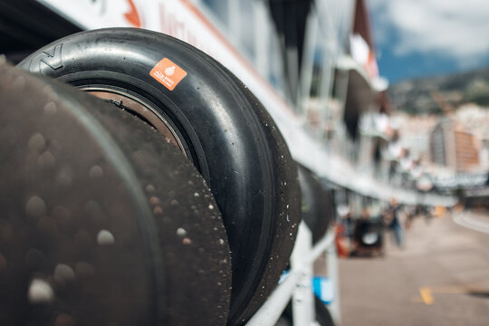 Racing tires stacked in motorsport paddock at race circuit
