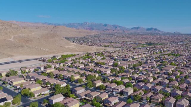 Southwest Las Vegas Ascending Aerial View of Suburban Homes and Desert Mountains