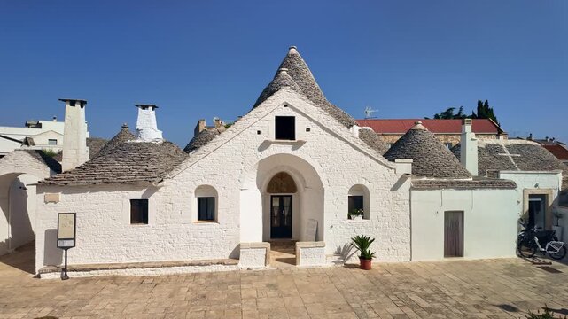 Beautiful Trullo Sovrano at sunny day in Alberobello, Puglia, Italy